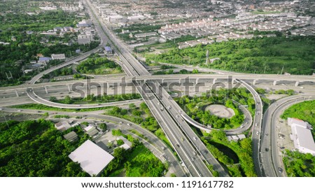 Aerial view of highway and overpass in city on a sunny day