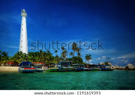 the beautiful island of Lengkuas in Belitung with blue sky and white beach, nice place for holiday  Royalty-Free Stock Photo #1191619393
