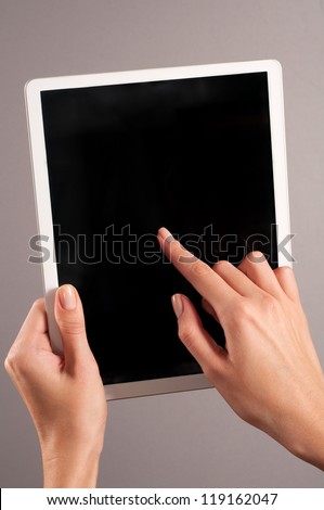Womans hands holding a tablet pc