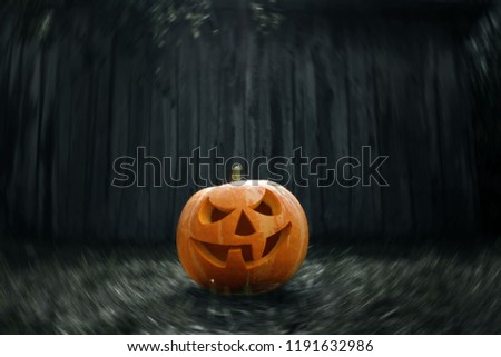 Creative background, Halloween pumpkin lantern with burning candles on a dark background. Mystic. Celebratory background for hellouin. Space for copying. Happy holiday.