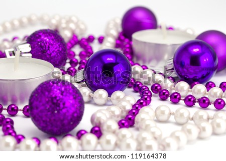 New Year's background from toys and a beads on a white background