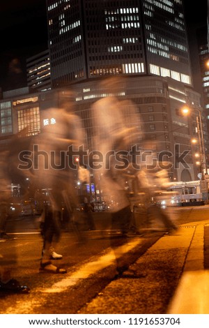 Long exposure people crossing the street at night, Japan