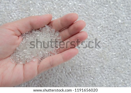 Woman hand holding Pet polyester chips,Plastic pet polyester chips,Chips bright Royalty-Free Stock Photo #1191656020