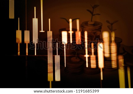 Abstract financial trading graphs and digital number of stock market exchange on monitor. Background of gold and blue digital chart to represent stock market trend.