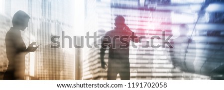 The double exposure image of the business man with cityscape image.