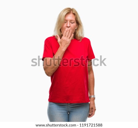 Middle age blonde woman over isolated background bored yawning tired covering mouth with hand. Restless and sleepiness.