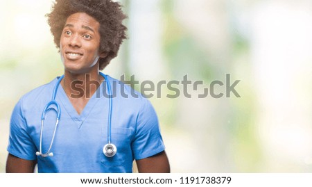 Afro american surgeon doctor man over isolated background smiling looking side and staring away thinking.