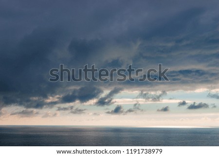 Heavy blue clouds over the sea dramatic seascape
