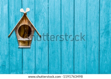 wood mailbox on blue wooden plank background. letters and messages, postman vintage view
