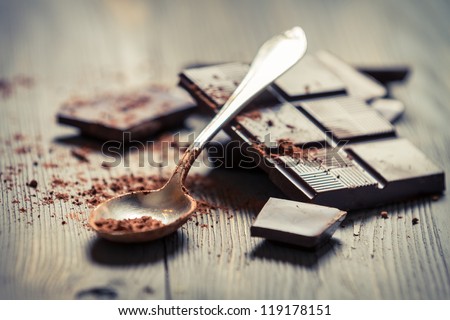 Closeup of Cocoa Powder and Dark Chocolate Royalty-Free Stock Photo #119178151