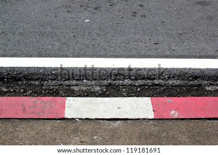 The damaged white asphalt on the road Royalty-Free Stock Photo #119181691
