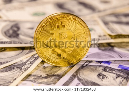 Bitcoin on a one hundred dollar bills