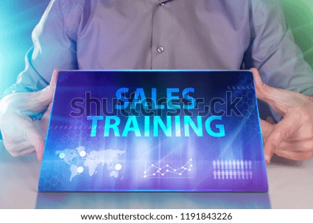 The concept of business, technology, the Internet and the network. A young entrepreneur working on a virtual screen of the future and sees the inscription: Sales training