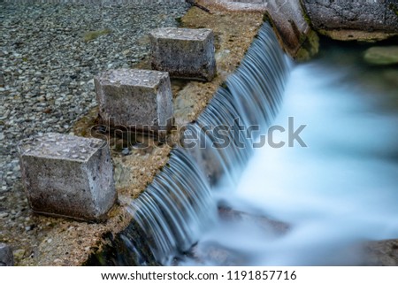 Long exposure at waterfall in the forest. Vertova, Bergamo, Italy