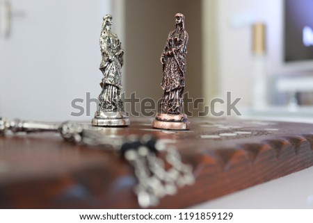 wooden chess board and metal chess