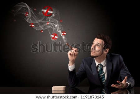 Businessman smoking with colored no smoking symbols nearby.