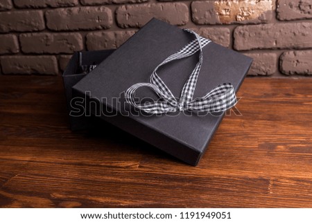 Box black gift ribbon bow white wooden Christmas