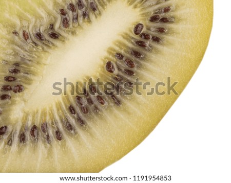 Closeup of a sliced ripe kiwi with seeds isolated on a white background, top view. A concept of exotic fruits.