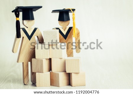Back to School, Students Sign wood Graduation celebrating cap with wooden square blocks tower. Ideas for abroad international Educational, Copy space for text background