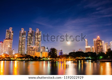 cityscape at night and a reflection of the river at Bangkok, Thailand