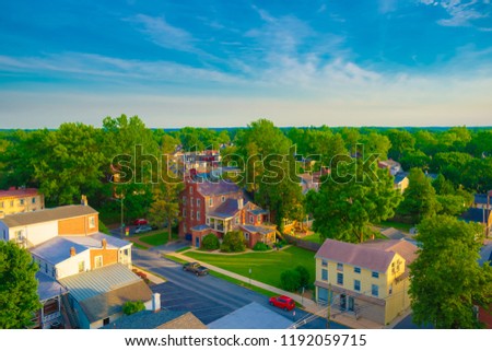 aerial view of suburban houses with blue sunset sky and warm sunlight on sunny day in Summer - West Chester, Pennsylvania USA Royalty-Free Stock Photo #1192059715