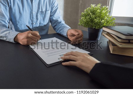 Business man signing contract making a deal.