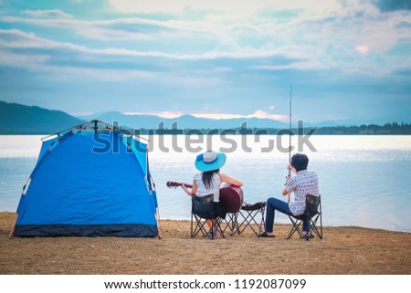 couple traveler have camping and picnic near the lake on vacation. 