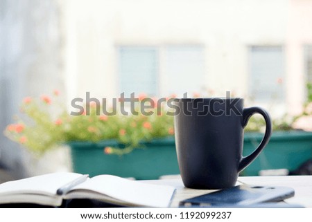 Coffee cup black color on wooden table