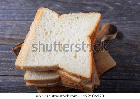 Sliced White Bread on Wooden Background