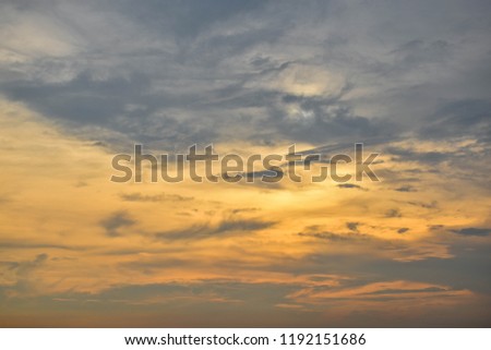 Beautiful Sky of simple gradient colours of orange and white clouds against blue sky.
Dramatic sunset and sunrise sky.