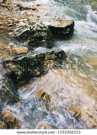 Mountain Creek. a rapid flow of water among the stones.
