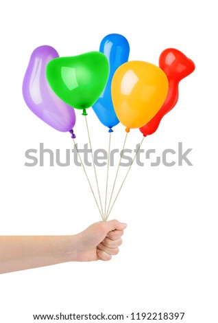Multicolored balloons in hand isolated on white background