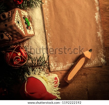 two Santa Claus and blank sheet for Christmas greetings .
