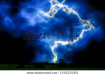 lightning near the high power pole in the field during the storm. Royalty-Free Stock Photo #1192233301