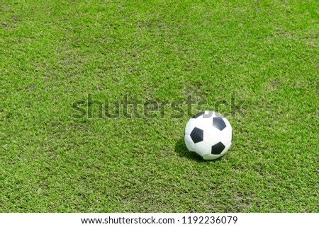 football field  ball on green grass , soccer field athletics background