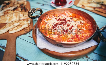 Traditional turkish food menemen made by eggs and tomatoes Royalty-Free Stock Photo #1192250734