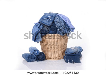 rolled Jeans with jeans shirt in the basket
