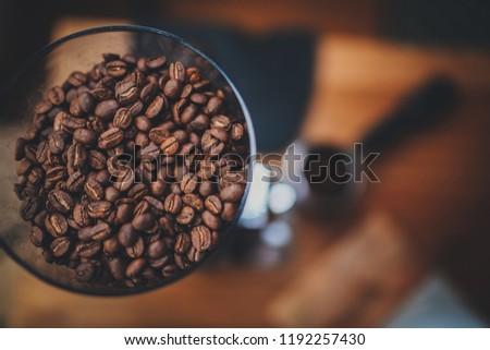 Good morning starts with fresh coffee. Top view image of organic coffee beans in a coffee grinder, Horizontal Cover image for website or social media with copy space for design or text message