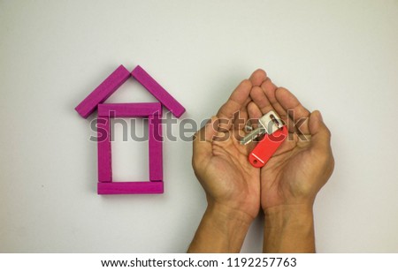 House or home model made by wooden block on white background. Buy Property or mortgage concept