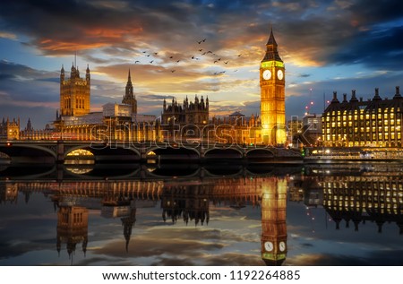 The Westminster Palace and the Big Ben clocktower by the Thames river in London, United Kingdom, just after sunset Royalty-Free Stock Photo #1192264885