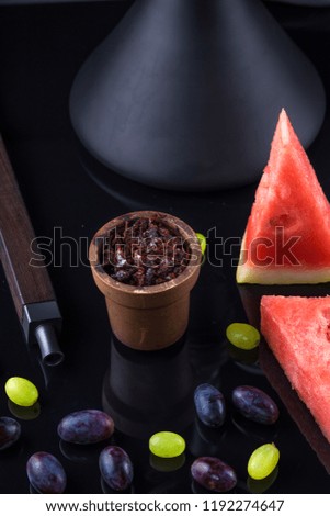 Shisha with Apple flavor in a clay bowl