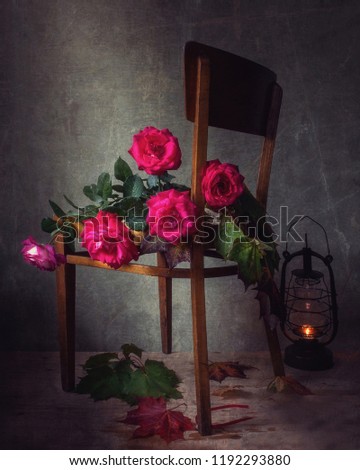 Still life with autumn roses in a country house