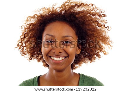 Closeup portrait of cute young black woman smiling isolated over white background