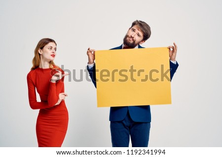 man with orange paper sheet woman in red dress mockup, poster                         