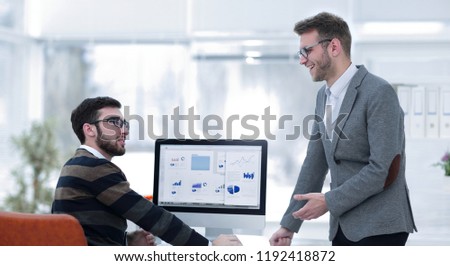 two businessmen analyzing stats financial data