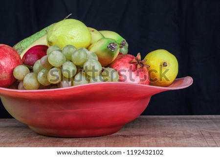 pomegranates in a bowl of fruit
