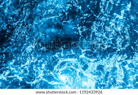 Blue deep sea foaming water background 