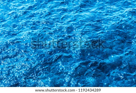 Blue deep sea foaming water background 