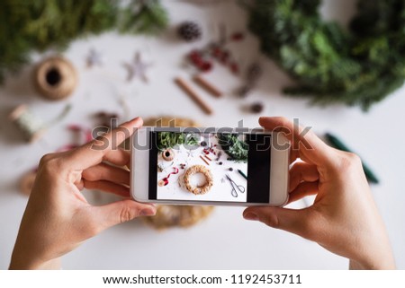 Christmas composition with smartphone on a white background.