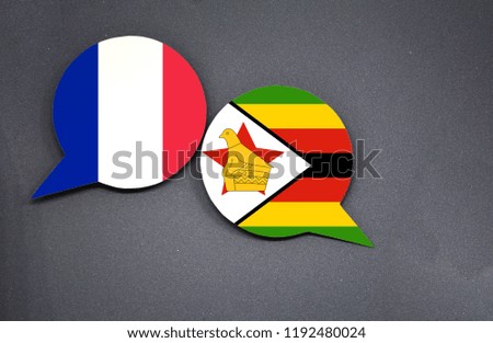 France and Zimbabwe flags with two speech bubbles on dark gray background